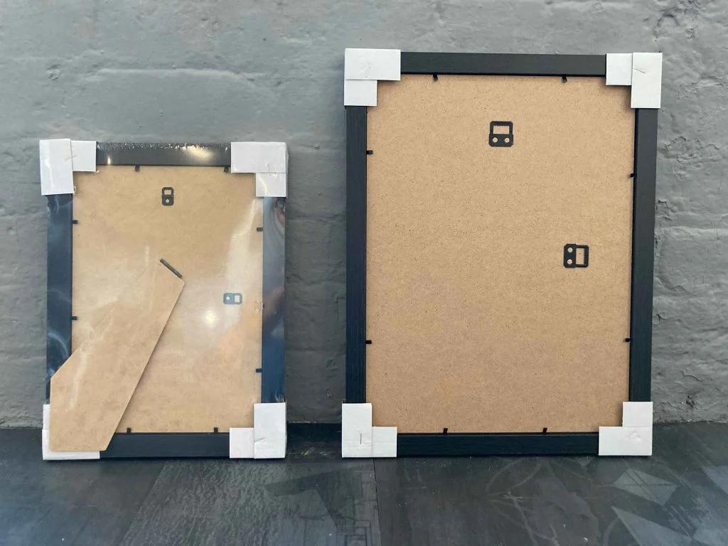 The back of two Picture the Stars frames showing the backboard, wall brackets and the A4 strut